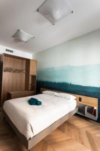 En eller flere senge i et værelse på Circolo degli Scipioni