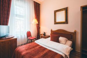 Postel nebo postele na pokoji v ubytování Hotel Ariston Prague