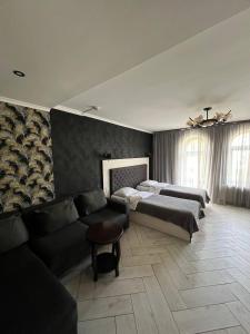 Postel nebo postele na pokoji v ubytování Гетьман Готель & SPA