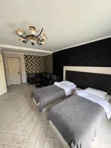 Postel nebo postele na pokoji v ubytování Гетьман Готель & SPA