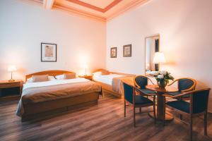 Postel nebo postele na pokoji v ubytování Hotel Ariston Prague