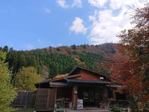 a cabin in the middle of a mountain with trees at AKAYA GLAMPING HOUSE - Vacation STAY 41979v in Fukuro