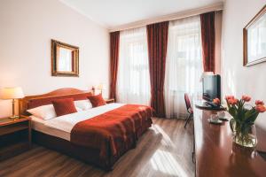 Postel nebo postele na pokoji v ubytování Hotel Ariston Prague