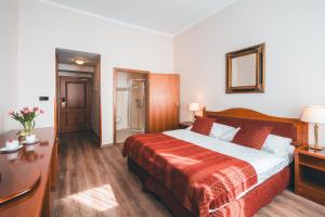 Postel nebo postele na pokoji v ubytování Hotel Ariston Prague