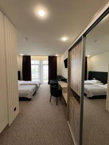 Postel nebo postele na pokoji v ubytování Гетьман Готель & SPA
