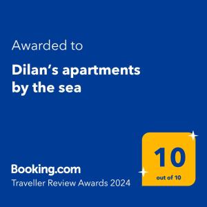a yellow sign with the text awarded to dhanans appointments by the sea at Dilan’s apartments by the sea in Bar