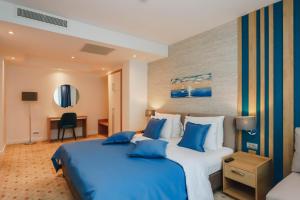 Postel nebo postele na pokoji v ubytování Hotel Montenegro