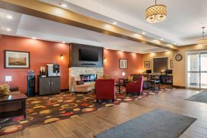 a lobby of a hotel with a living room at Best Western Plus Kindersley Hotel in Kindersley