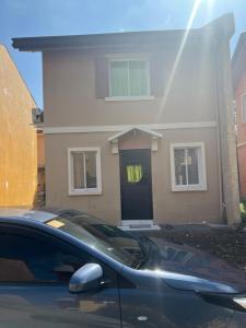 a house with a car parked in front of it at Affordable 2 storey transient house with free wifi in Camella Homes Koronadal in Carpenter