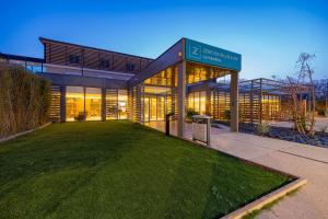 a building with a lawn in front of it at Zenitude Hotel La Valadière, Ascend Hotel Collection in Montpellier