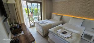 Кровать или кровати в номере The D Hotel Çeşme Resort