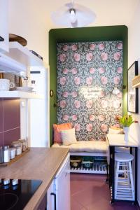 a living room with a bench against a wall at cozinesT eco apartment in Zagreb