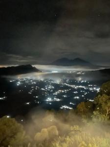 a view of a city at night at pinggan sunrise glamping in Baturaja