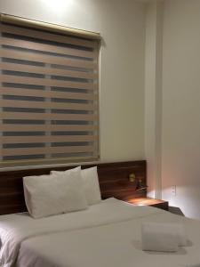 Letto o letti in una camera di Hong Nhan Hotel