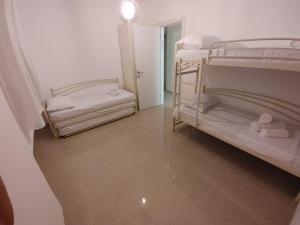 a room with two bunk beds and a hallway at וילה מפוארת על הכינרת in Tiberias