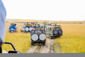 a group of vehicles parked on a dirt road at Wildlife Enthusiasts in Sekenani