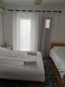 Säng eller sängar i ett rum på Bitola