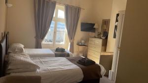 Cama o camas de una habitación en Royal Grosvenor Hotel