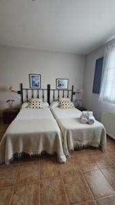 Een bed of bedden in een kamer bij Apartamentos Castello