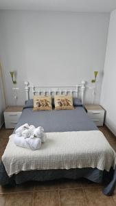 Кровать или кровати в номере Apartamentos Castello