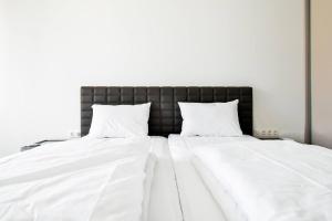 Ένα ή περισσότερα κρεβάτια σε δωμάτιο στο Nomad Friendly Modern Complex Next To Metro