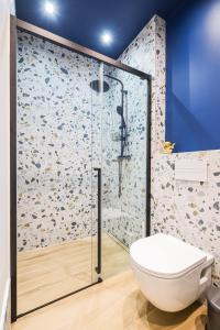 a bathroom with a glass shower with a toilet at Monsignore in Zadar