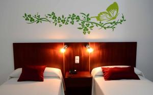 A bed or beds in a room at Hotel LIVVO Don Paco
