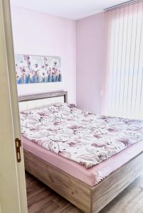 מיטה או מיטות בחדר ב-Апартамент Франческа