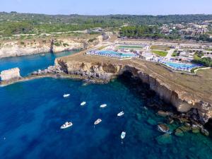 an aerial view of a cove with boats in the water at 19 Summer Suites in Santa Cesarea Terme