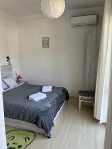 A bed or beds in a room at Guest house Junona