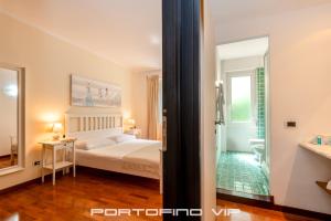 Postel nebo postele na pokoji v ubytování Attico by PortofinoVip