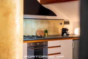 Kuchyň nebo kuchyňský kout v ubytování Attico by PortofinoVip