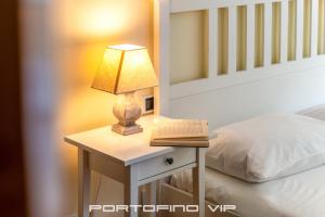 Postel nebo postele na pokoji v ubytování Attico by PortofinoVip