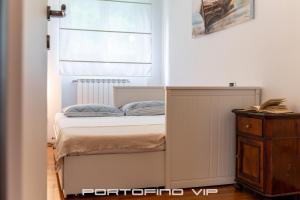 Postel nebo postele na pokoji v ubytování Attico by PortofinoVip