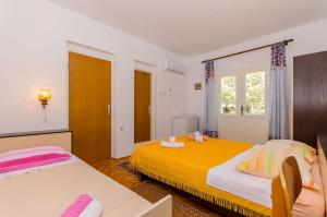 Posteľ alebo postele v izbe v ubytovaní Rooms Ante