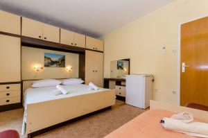 Posteľ alebo postele v izbe v ubytovaní Rooms Ante