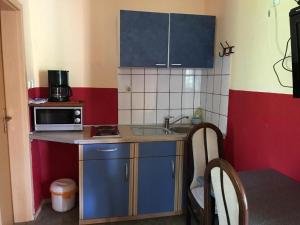 Kuchyň nebo kuchyňský kout v ubytování Apartment Pero
