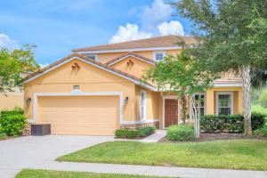 a house with a driveway and a garage at Solterra Resort Home - Waterslide and Lazy River in Davenport