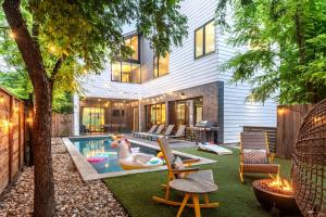 a backyard with a pool with a duck swimming at Backyard Pool Oasis - Rainey Street - 6 min walk in Austin