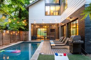 a swimming pool in the backyard of a house at Backyard Pool Oasis - Rainey Street - 6 min walk in Austin