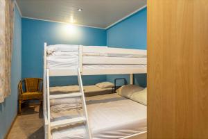a bunk bed room with two bunk beds in it at Rembrandt Glv in Wenduine