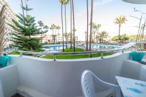 a view of the pool from the balcony of a resort at Paraiso maspalomas sunset by CALIMA HOMES in San Bartolomé