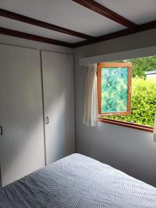 Postel nebo postele na pokoji v ubytování Vakantiehuisje Veluwe, Alleen Voor Recreatie + 15 fotografií