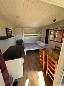 Postel nebo postele na pokoji v ubytování Steiner's Camping & Lodge