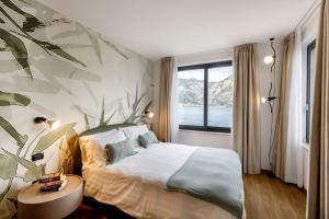 Postel nebo postele na pokoji v ubytování Piccolo Hotel + 37 fotografií