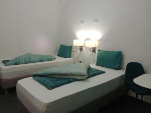 Postel nebo postele na pokoji v ubytování Rezidencija Arion