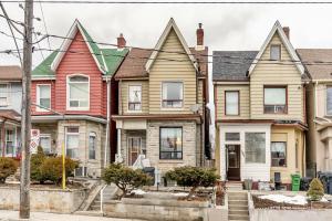 a row of houses on a street at 2 Bedroom Apartment in the Heart of Trinity Bellwoods in Toronto