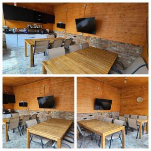 a conference room with a wooden table and a tv at Ionela in Eforie Nord