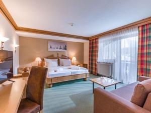 Postelja oz. postelje v sobi nastanitve SCOL Sporthotel Zillertal