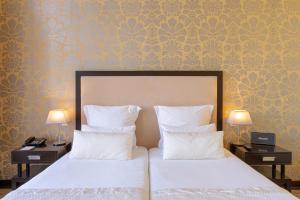 Cama ou camas em um quarto em Hotel Inglaterra - Charme & Boutique